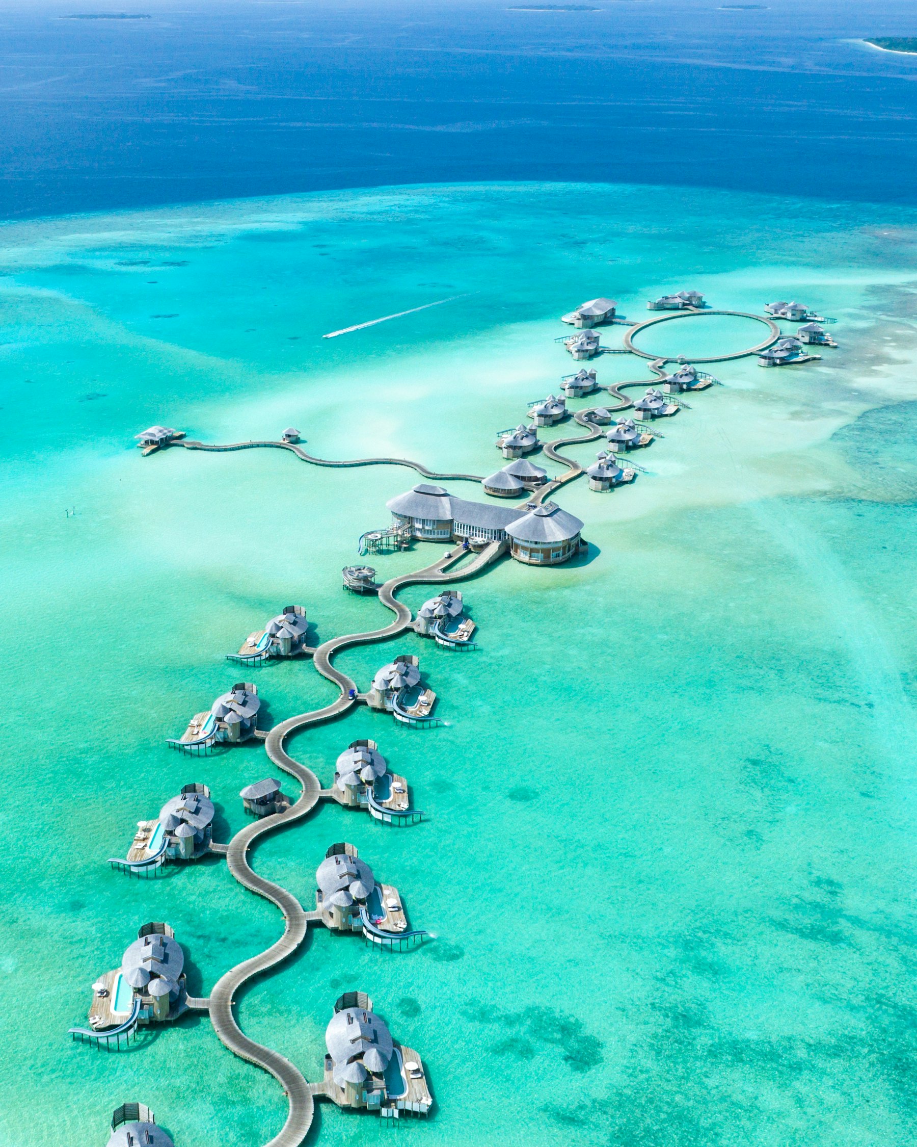 Aerial view of a Maldivian resort island and its lagoon