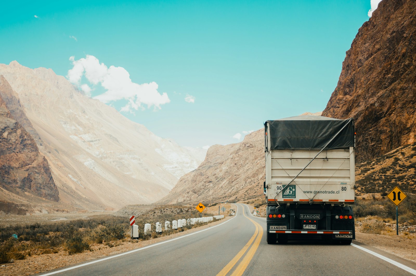 Freight truck delivering cargo along a coastal route